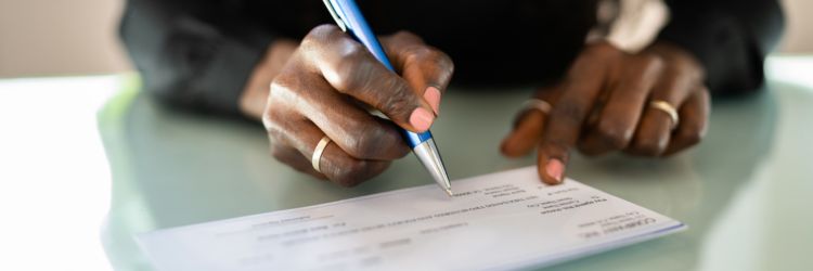 Woman Writing a Check