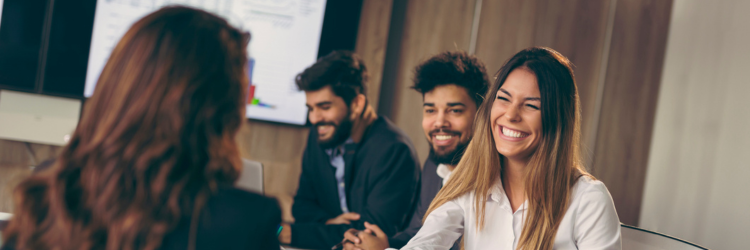 Coworkers smiling in a meeting